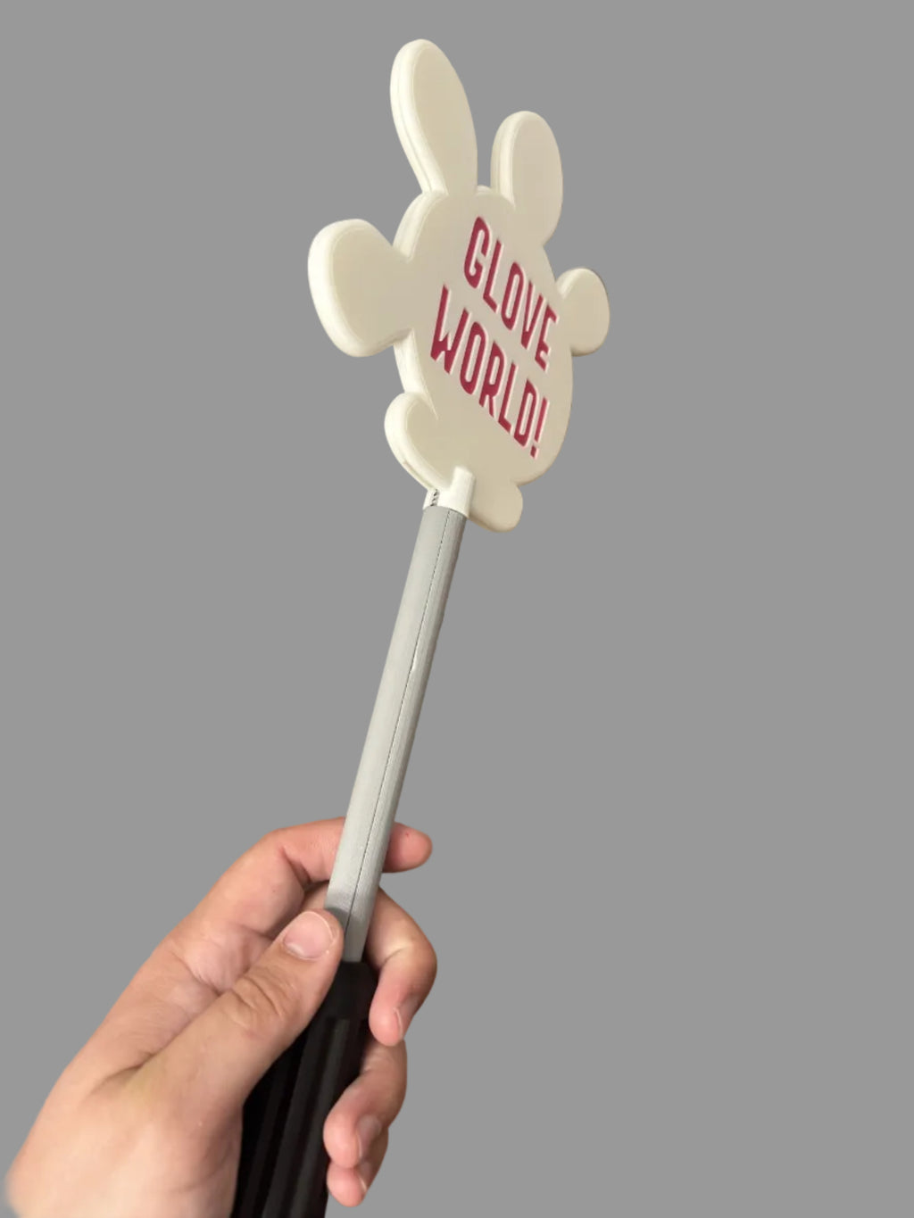 Hand holding a wand with 'Glove World!' text